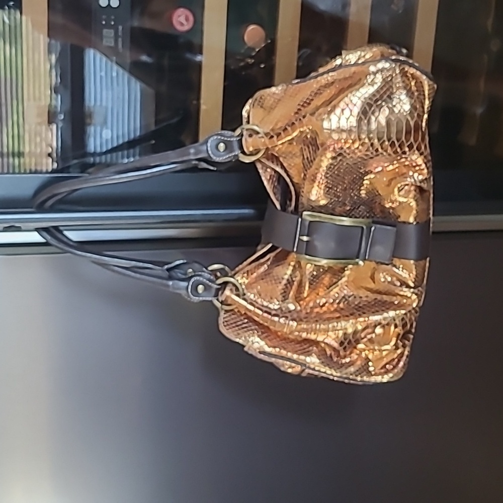 Puntotres copper leather satchel